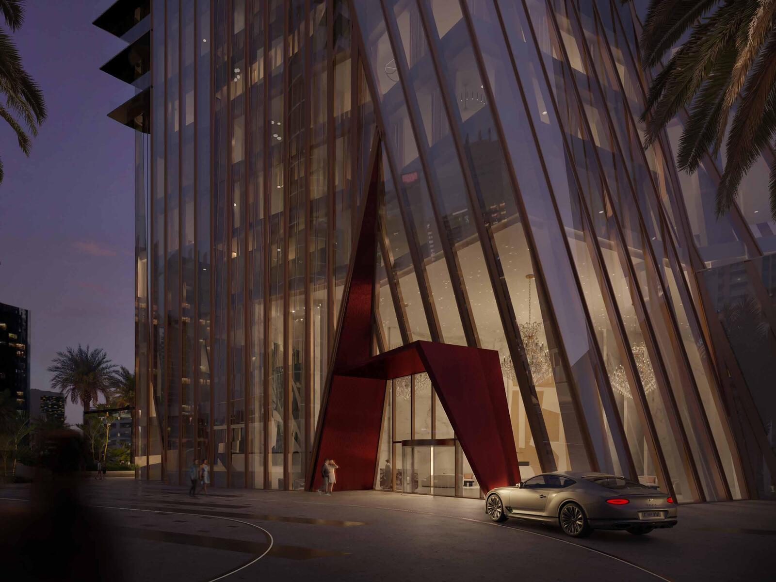 a car parked in front of a tall building